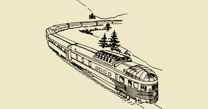 Zug der in einer Landschaft fährt