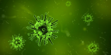 Bild eines Virus in grün gehalten, im Hintergrund mehrere weitere Viren